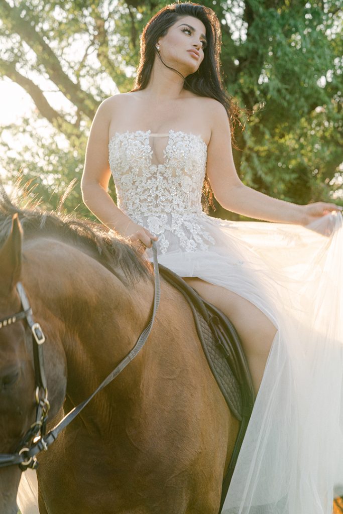 equestrian rider mounted on her horse ethereal dreamy flowing white gown