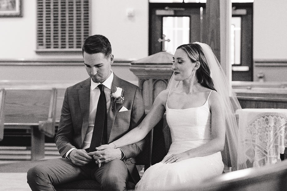 black and white image of couple in a church