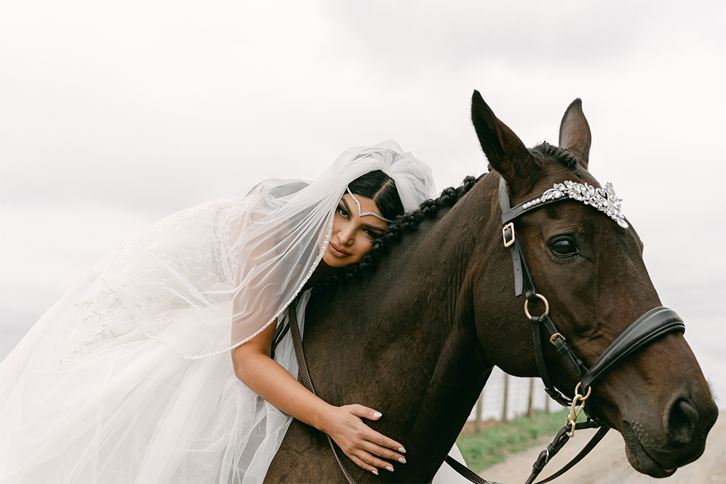 bride hugging her horse